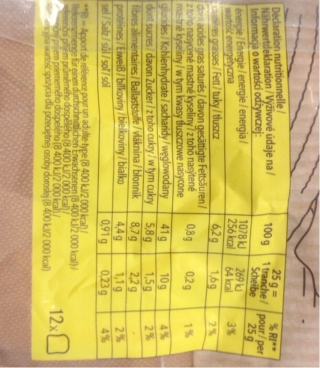 A nutrition label photographed rotated 90 degrees, still reading 1078 kJ and 256 kcal per 100 g.